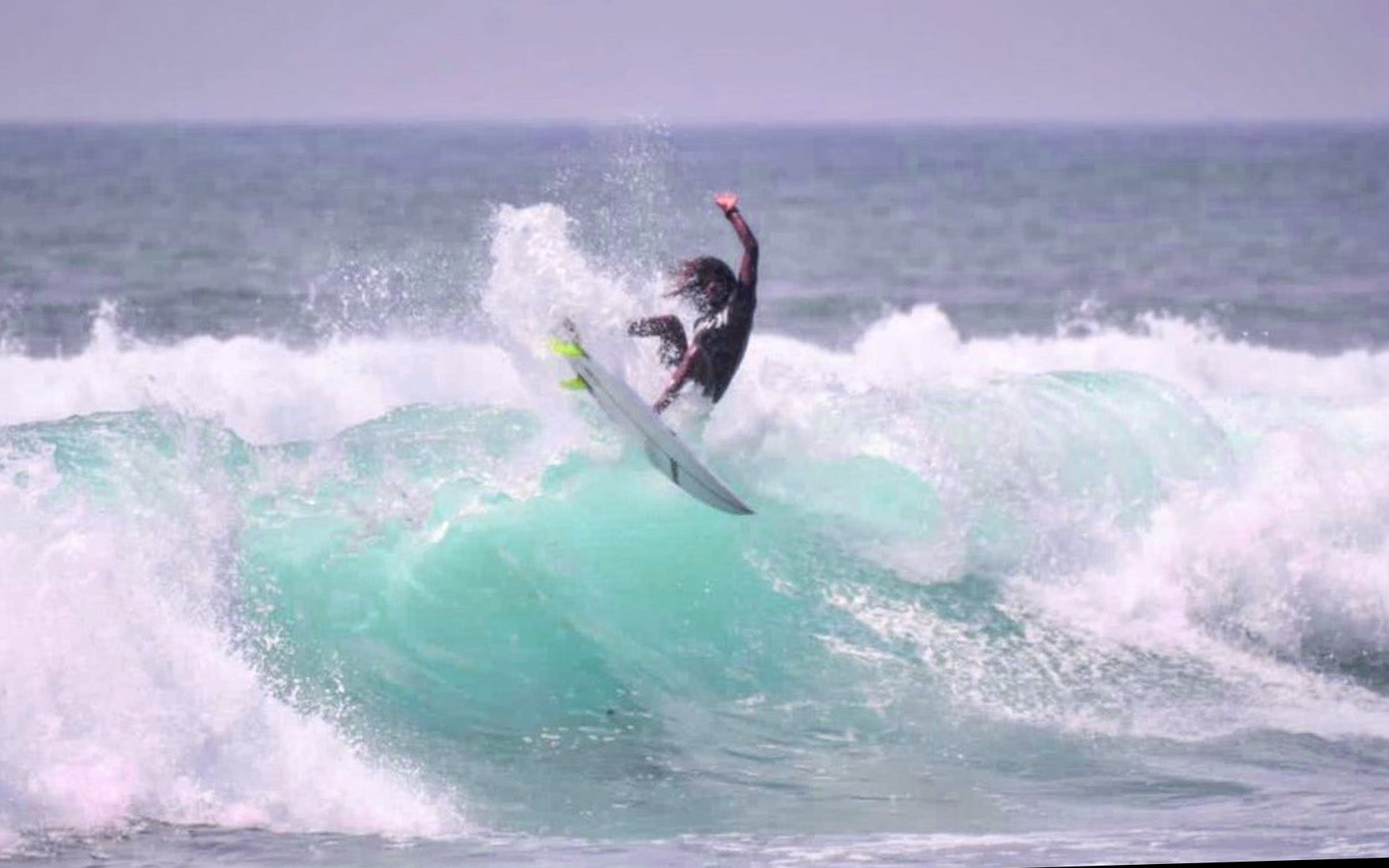 Weligama surf lessons with Amila, photo of surf instructor Amila surfing 