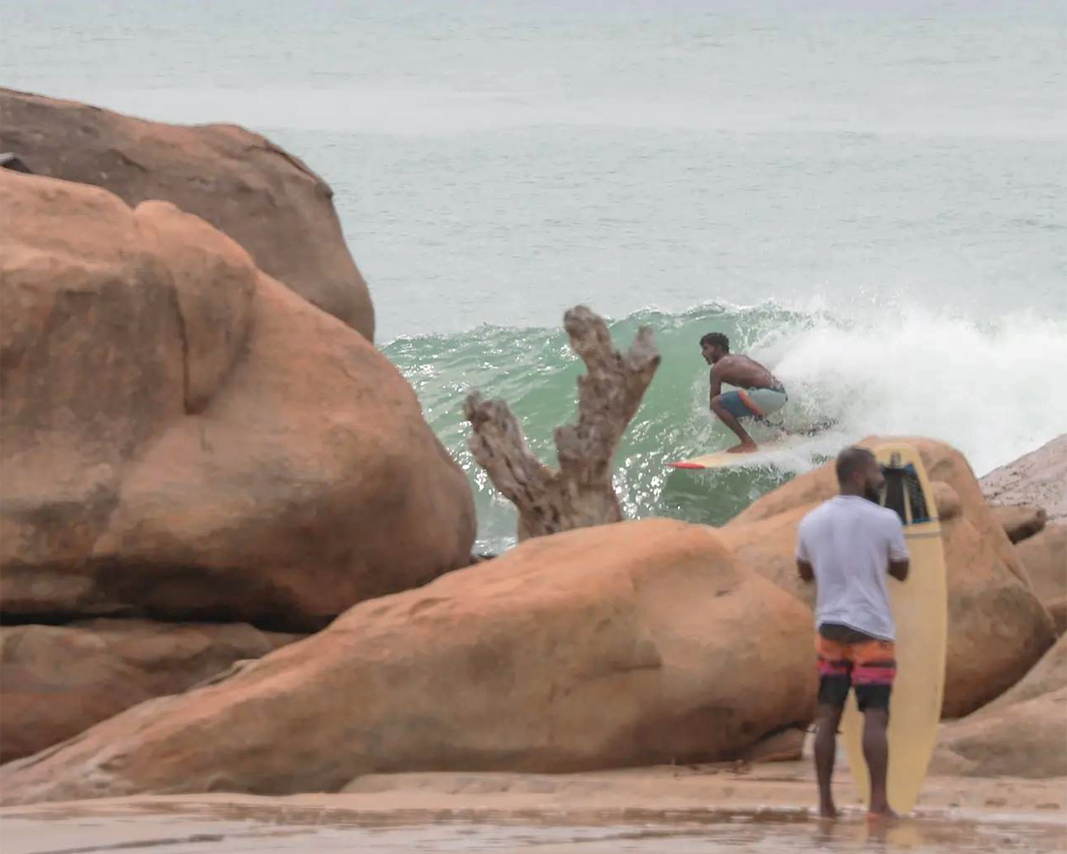 Arugam Bay surf lessons with Babu, photo of surf instructor Babu surfing 