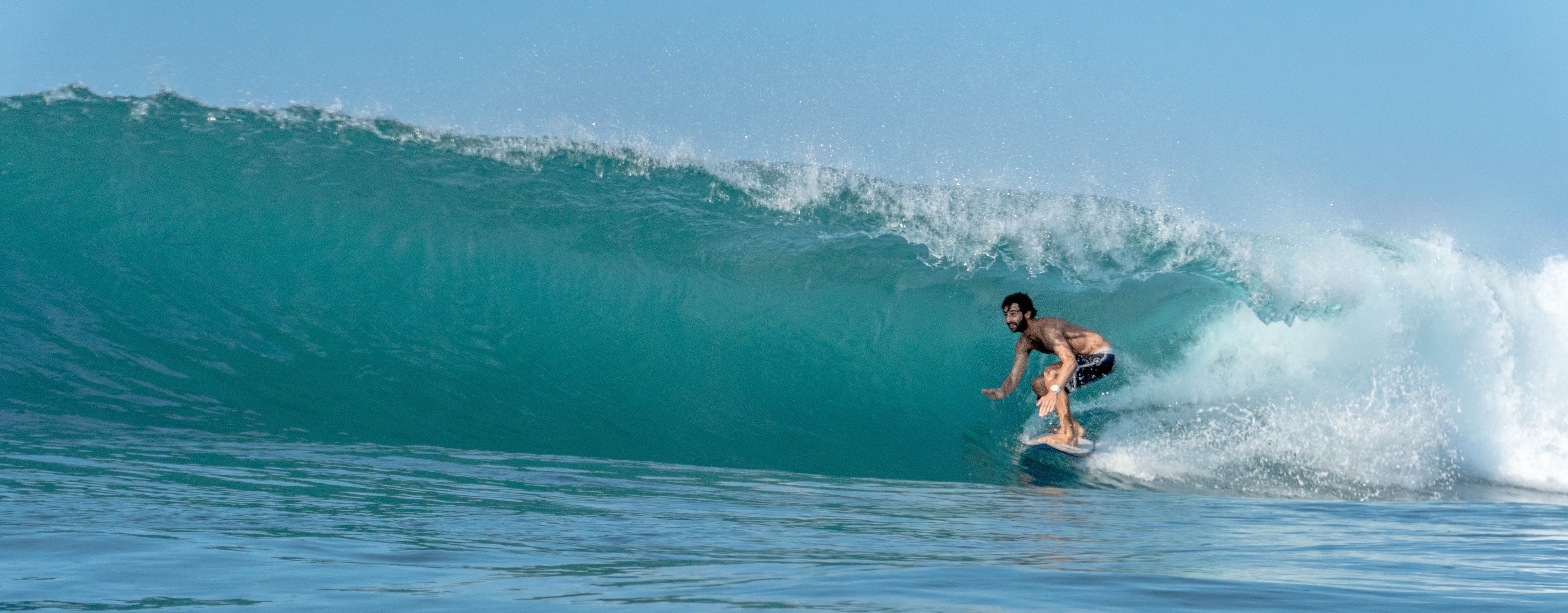 Photo of Eden surfing a barrel at Rams Midigama Sri Lanka