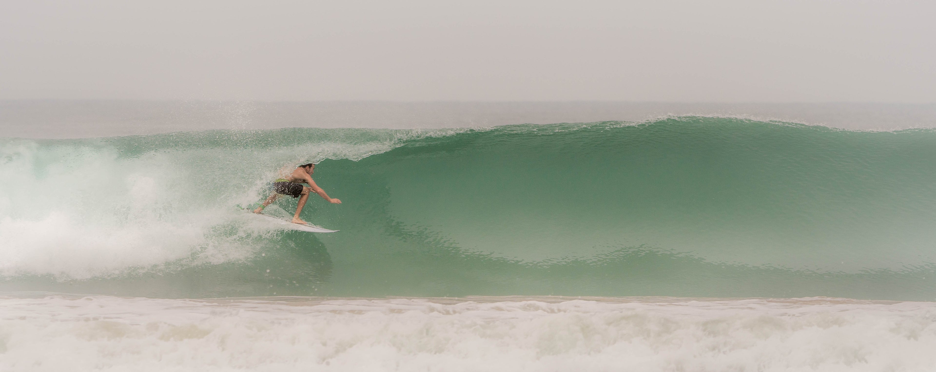 Photo of Tristan surfing a barrel at Kabalana Beach Sri Lanka